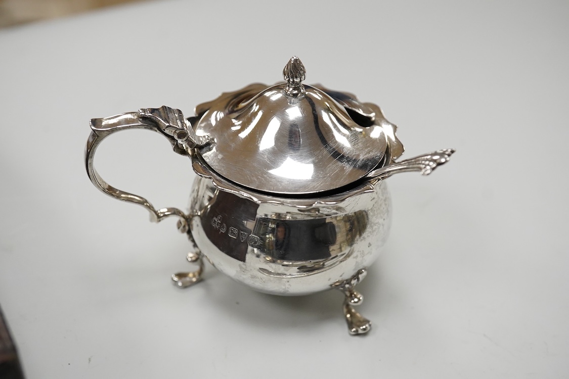 Three assorted 20th century silver napkin rings, a George V silver mustard pot and pepperette, a set of six late Victorian silver coffee spoons, London, 1883, and six other silver items.